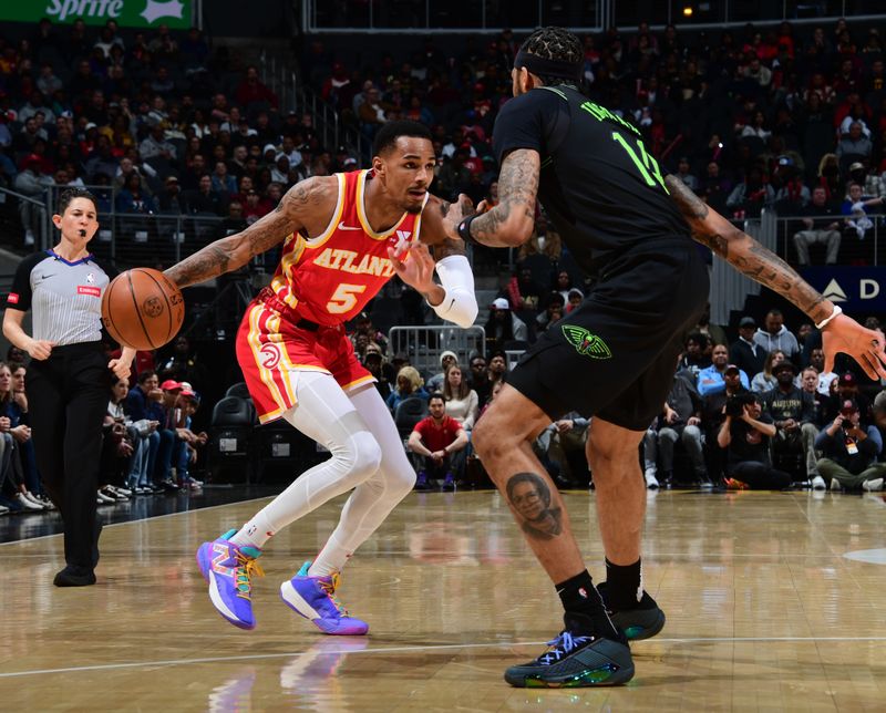 ATLANTA, GA - MARCH 10: Dejounte Murray #5 of the Atlanta Hawks dribbles the ball during the game against the New Orleans Pelicans on March 10, 2024 at State Farm Arena in Atlanta, Georgia.  NOTE TO USER: User expressly acknowledges and agrees that, by downloading and/or using this Photograph, user is consenting to the terms and conditions of the Getty Images License Agreement. Mandatory Copyright Notice: Copyright 2024 NBAE (Photo by Scott Cunningham/NBAE via Getty Images)