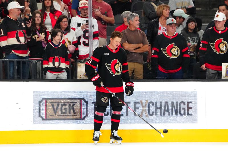 Oct 25, 2024; Las Vegas, Nevada, USA; Ottawa Senators center Tim Stützle (18) warms up before a game against the Vegas Golden Knights at T-Mobile Arena. Mandatory Credit: Stephen R. Sylvanie-Imagn Images