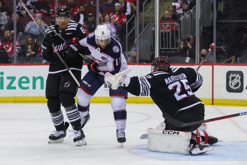 Mar 11, 2025; Newark, New Jersey, USA; New Jersey Devils goaltender Jacob Markstrom (25) makes a save against the Columbus Blue Jackets during the third period at Prudential Center. Mandatory Credit: Ed Mulholland-Imagn Images