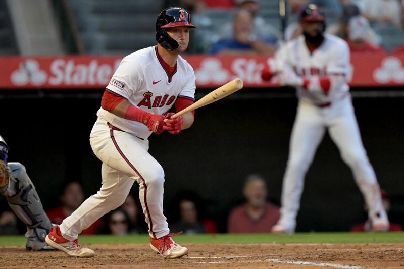 Jul 30, 2024; Anaheim, California, USA;  Los Angeles Angels catcher Matt Thaiss (21) doubles in two runs in the third inning against the Colorado Rockies at Angel Stadium. Mandatory Credit: Jayne Kamin-Oncea-USA TODAY Sports