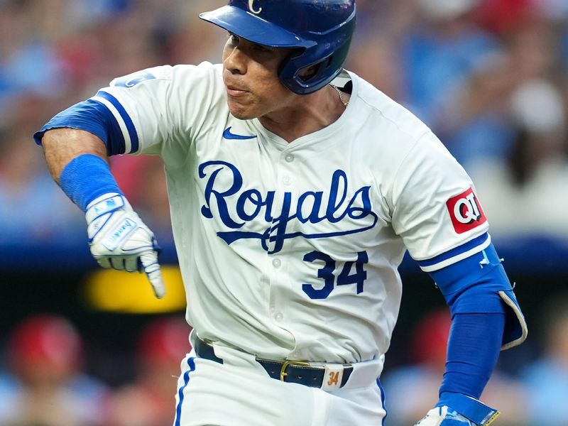 Aug 10, 2024; Kansas City, Missouri, USA; Kansas City Royals catcher Freddy Fermin (34) celebrates after hitting an RBI single during the sixth inning against the St. Louis Cardinals at Kauffman Stadium. Mandatory Credit: Jay Biggerstaff-USA TODAY Sports