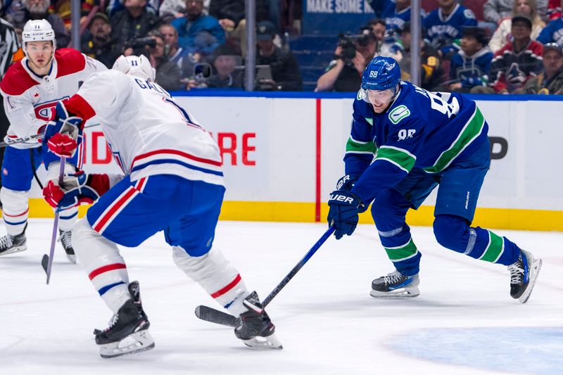 Mar 21, 2024; Vancouver, British Columbia, CAN; Vancouver Canucks forward Nils Aman (88) reaches for the loose puck against the Montreal Canadiens in the third period at Rogers Arena. Vancouver won 4 -1. Mandatory Credit: Bob Frid-USA TODAY Sports