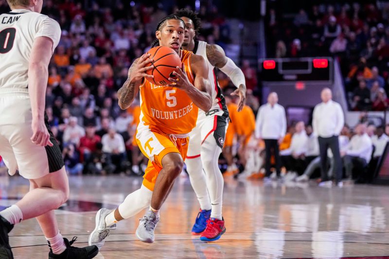 Jan 13, 2024; Athens, Georgia, USA; Tennessee Volunteers guard Zakai Zeigler (5) drives to the basket against the Georgia Bulldogs during the first half at Stegeman Coliseum. Mandatory Credit: Dale Zanine-USA TODAY Sports