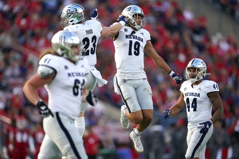 Oct 23, 2021; Fresno, California, USA; Nevada Wolf Pack tight end Cole Turner (19) celebrates after scoring a touchdown against the Fresno State Bulldogs in the second quarter at Bulldog Stadium. Mandatory Credit: Cary Edmondson-USA TODAY Sports