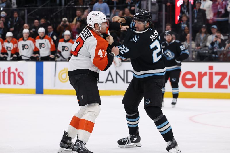 Jan 21, 2026; Salt Lake City, Utah, USA; Philadelphia Flyers defenseman Noah Juulsen (47) and Utah Mammoth center Jack McBain (22) fight during the third period at Delta Center. Mandatory Credit: Rob Gray-Imagn Images