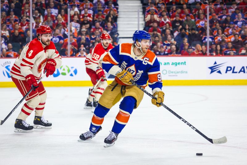 Jan 20, 2024; Calgary, Alberta, CAN; Edmonton Oilers center Connor McDavid (97) controls the puck against the Calgary Flames during the first period at Scotiabank Saddledome. Mandatory Credit: Sergei Belski-USA TODAY Sports