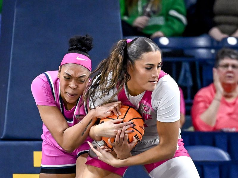 Feb 12, 2023; South Bend, Indiana, USA; Syracuse Orange forward Saniaa Wilson (21) and Notre Dame Fighting Irish forward Kylee Watson (22) attempt to control a rebound in the first half at the Purcell Pavilion. Mandatory Credit: Matt Cashore-USA TODAY Sports