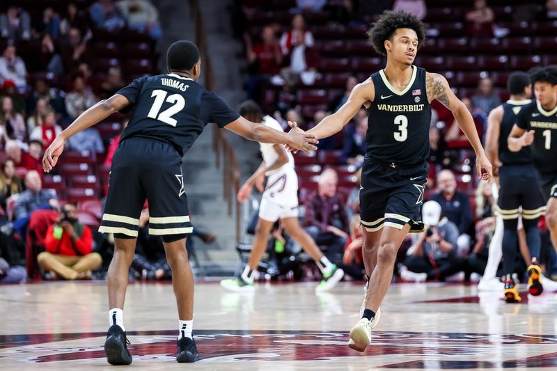 Feb 14, 2023; Columbia, South Carolina, USA; Vanderbilt Commodores guard Paul Lewis (3) and guard Trey Thomas (12) celebrate a three pointer basket by Lewis in the first half at Colonial Life Arena. Mandatory Credit: Jeff Blake-USA TODAY Sports