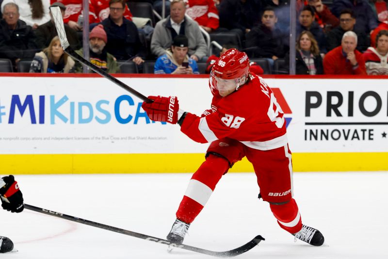 Jan 7, 2025; Detroit, Michigan, USA; Detroit Red Wings right wing Patrick Kane (88) takes a shot in overtime against the Ottawa Senators at Little Caesars Arena. Mandatory Credit: Rick Osentoski-Imagn Images