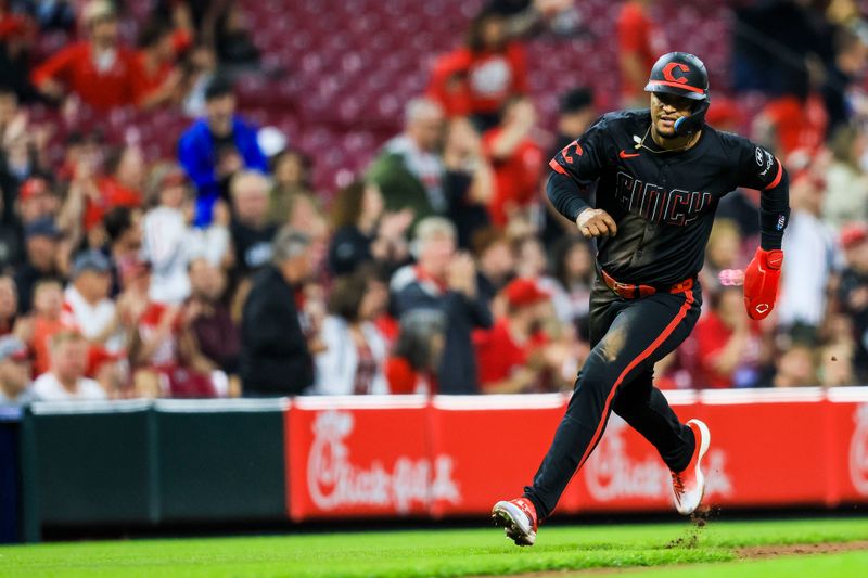 May 2, 2025; Cincinnati, Ohio, USA; Cincinnati Reds outfielder Santiago Espinal (4) scores on a two-run double hit by designated hitter Tyler Stephenson (not pictured) in the third inning against the Washington Nationals at Great American Ball Park. Mandatory Credit: Katie Stratman-Imagn Images