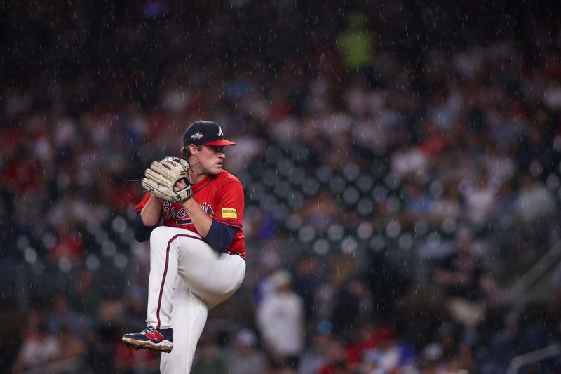 Jun 27, 2025; Atlanta, Georgia, USA; Atlanta Braves starting pitcher Bryce Elder (55) throws in the rain against the Philadelphia Phillies in the second inning at Truist Park. Mandatory Credit: Brett Davis-Imagn Images