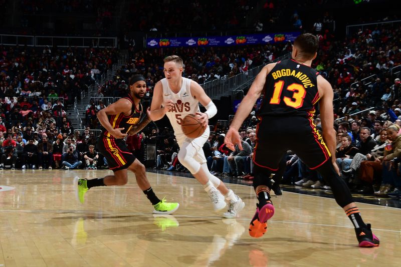 ATLANTA, GA - JANUARY 20: Sam Merrill #5 of the Cleveland Cavaliers drives to the basket during the game against the Atlanta Hawks on January 20, 2024 at State Farm Arena in Atlanta, Georgia.  NOTE TO USER: User expressly acknowledges and agrees that, by downloading and/or using this Photograph, user is consenting to the terms and conditions of the Getty Images License Agreement. Mandatory Copyright Notice: Copyright 2024 NBAE (Photo by Scott Cunningham/NBAE via Getty Images)