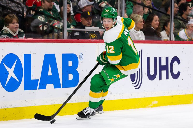 Jan 27, 2024; Saint Paul, Minnesota, USA; Minnesota Wild left wing Matt Boldy (12) skates with the puck during the second period against the Anaheim Ducks at Xcel Energy Center. Mandatory Credit: Matt Krohn-USA TODAY Sports