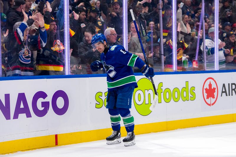 Apr 8, 2024; Vancouver, British Columbia, CAN;  Vancouver Canucks forward Conor Garland (8) celebrates his goal against the Vegas Golden Knights in the first period  at Rogers Arena. Mandatory Credit: Bob Frid-USA TODAY Sports