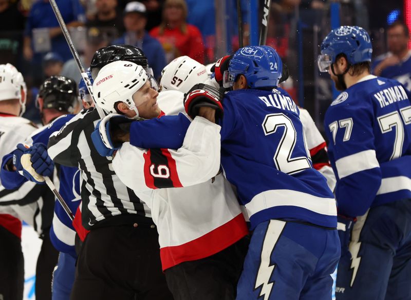 Apr 11, 2024; Tampa, Florida, USA; Ottawa Senators defenseman Jakob Chychrun (6) and Tampa Bay Lightning defenseman Matt Dumba (24) fight during the second period at Amalie Arena. Mandatory Credit: Kim Klement Neitzel-USA TODAY Sports