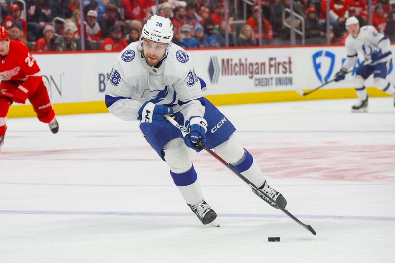 Jan 21, 2024; Detroit, Michigan, USA; Tampa Bay Lightning left wing Brandon Hagel (38) handles the puck during the third period against the Detroit Red Wings at Little Caesars Arena. Mandatory Credit: Brian Bradshaw Sevald-USA TODAY Sports