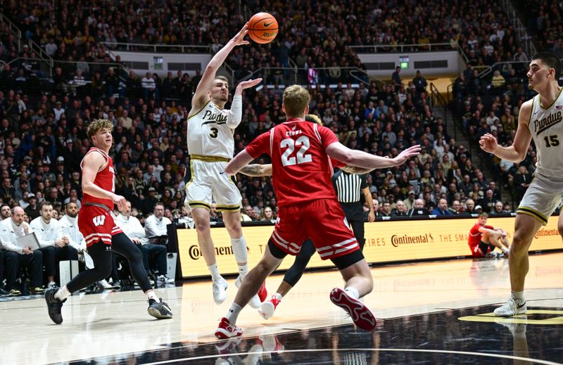 Mar 10, 2024; West Lafayette, Indiana, USA; Purdue Boilermakers guard Braden Smith (3) passes the ball away from several Wisconsin Badgers during the second half at Mackey Arena. Mandatory Credit: Marc Lebryk-USA TODAY Sports