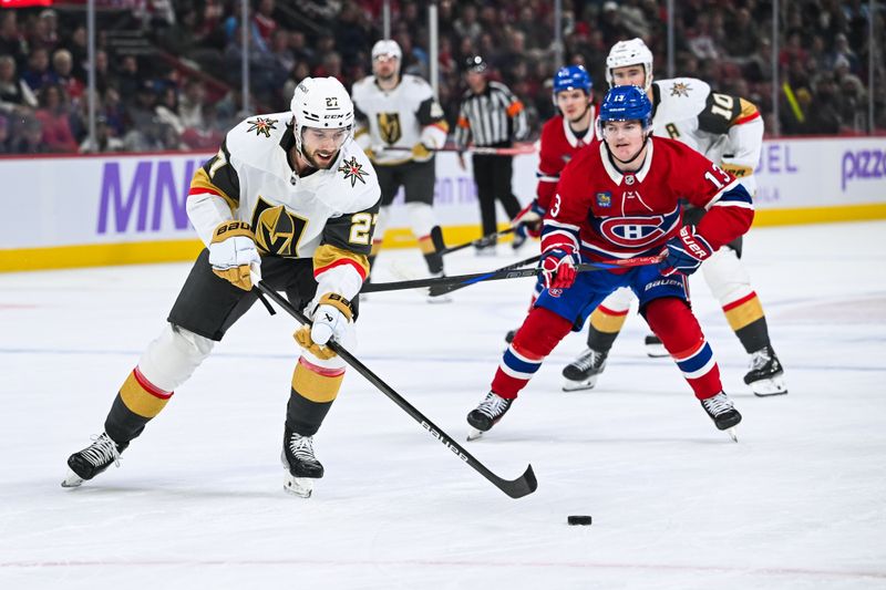 Nov 23, 2024; Montreal, Quebec, CAN; Las Vegas Golden Knights defenseman Shea Theodore (27) plays the puck against the Montreal Canadiens during the first period at Bell Centre. Mandatory Credit: David Kirouac-Imagn Images