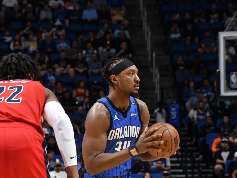 ORLANDO, FL - FEBRUARY 23: Wendell Carter Jr. #34 of the Orlando Magic handles the ball during the game against the Washington Wizards on February 23, 2025 at Kia Center in Orlando, Florida. NOTE TO USER: User expressly acknowledges and agrees that, by downloading and or using this photograph, User is consenting to the terms and conditions of the Getty Images License Agreement. Mandatory Copyright Notice: Copyright 2025 NBAE (Photo by Fernando Medina/NBAE via Getty Images)