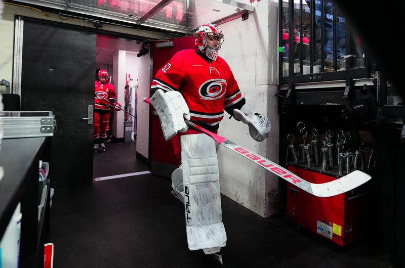 Jan 11, 2024; Raleigh, North Carolina, USA; Carolina Hurricanes goaltender Pyotr Kochetkov (52) comes out of the locker room for the warmups before the game Anaheim Ducks at PNC Arena. Mandatory Credit: James Guillory-USA TODAY Sports