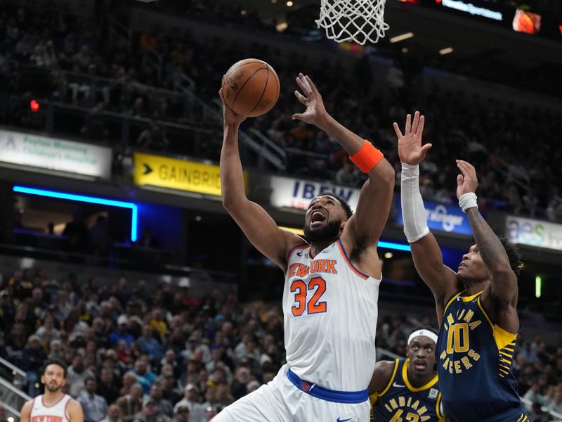 INDIANAPOLIS, IN - FEBRUARY 11: Karl-Anthony Towns #32 of the New York Knicks drives to the basket during the game against the Indiana Pacers on February 11, 2025 at Gainbridge Fieldhouse in Indianapolis, Indiana. NOTE TO USER: User expressly acknowledges and agrees that, by downloading and or using this Photograph, user is consenting to the terms and conditions of the Getty Images License Agreement. Mandatory Copyright Notice: Copyright 2025 NBAE (Photo by A.J. Mast/NBAE via Getty Images)