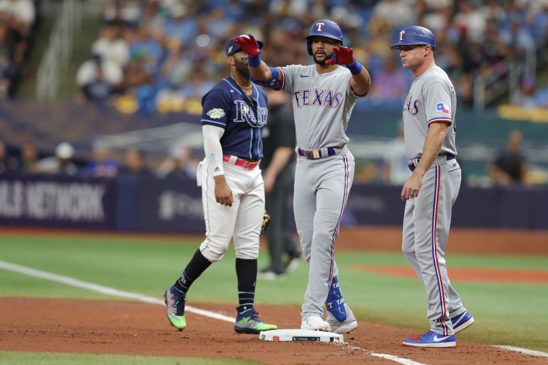 Oct 4, 2023; St. Petersburg, Florida, USA; Texas Rangers center fielder Leody Taveras (3) reacts after his single against the Tampa Bay Rays in the fourth inning during game two of the Wildcard series for the 2023 MLB playoffs at Tropicana Field. Mandatory Credit: Nathan Ray Seebeck-USA TODAY Sports