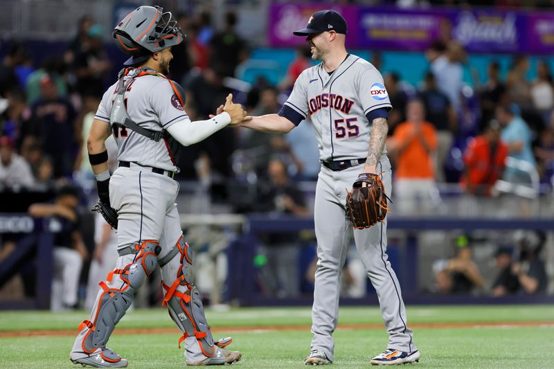 Aug 15, 2023; Miami, Florida, USA; Houston Astros relief pitcher Ryan Pressly (55) celebrates with catcher Yainer Diaz (21) after defeating the Miami Marlins at loanDepot Park. Mandatory Credit: Sam Navarro-USA TODAY Sports