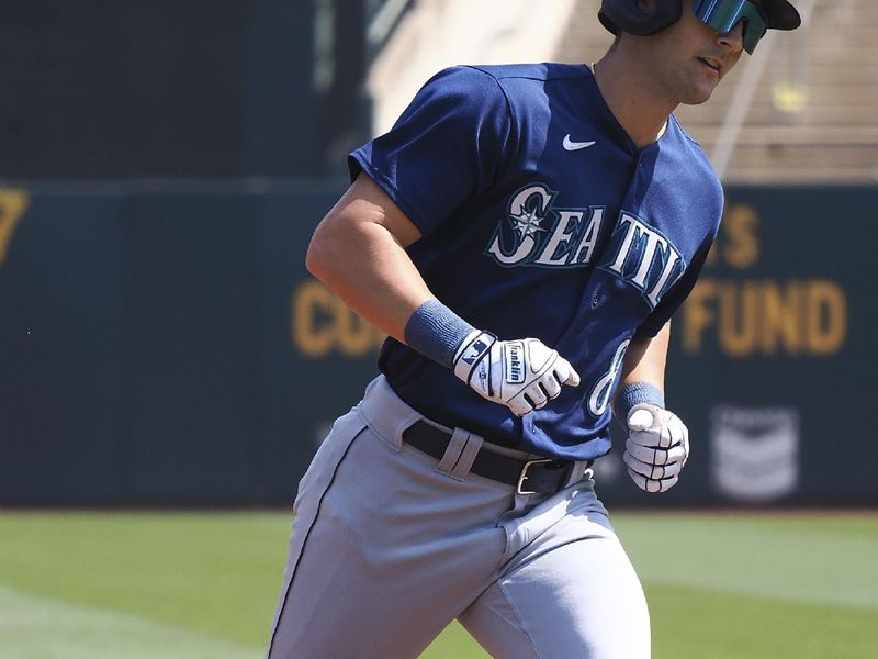 Sep 20, 2023; Oakland, California, USA; Seattle Mariners left fielder Dominic Canzone (8) rounds the bases on a two-run home run against the Oakland Athletics during the second inning at Oakland-Alameda County Coliseum. Mandatory Credit: Kelley L Cox-USA TODAY Sports