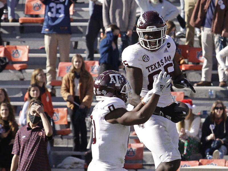 Dec 5, 2020; Auburn, Alabama, USA;  Texas A&M Aggies tight end Jalen Wydermyer (85) celebrates with running back Ainias Smith (0) after scoring a touchdown against the Auburn Tigers during the fourth quarter at Jordan-Hare Stadium. Mandatory Credit: John Reed-USA TODAY Sports