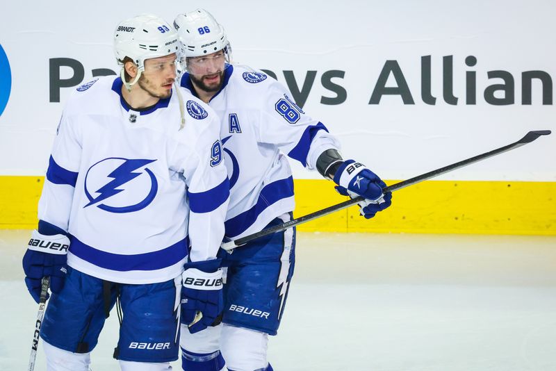 Jan 21, 2023; Calgary, Alberta, CAN; Tampa Bay Lightning right wing Nikita Kucherov (86) and defenseman Mikhail Sergachev (98) during the warmup period against the Calgary Flames at Scotiabank Saddledome. Mandatory Credit: Sergei Belski-USA TODAY Sports