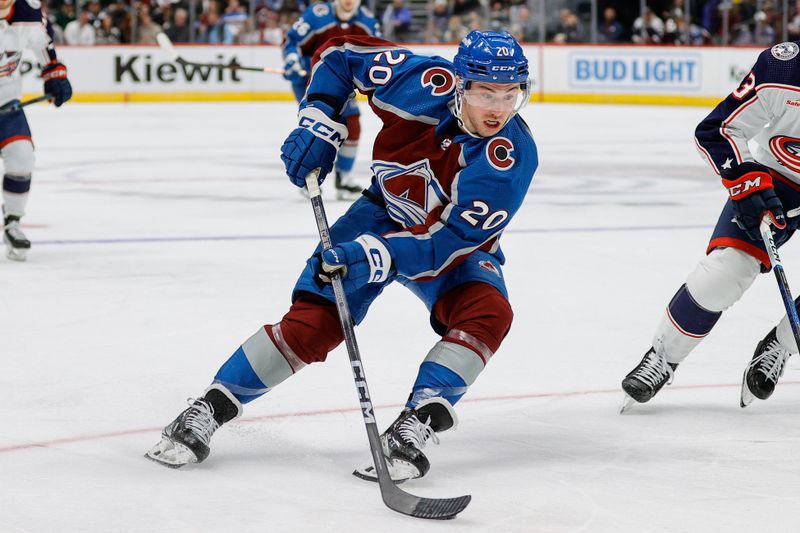 Mar 22, 2024; Denver, Colorado, USA; Colorado Avalanche center Ross Colton (20) controls the puck in the second period against the Columbus Blue Jackets at Ball Arena. Mandatory Credit: Isaiah J. Downing-USA TODAY Sports