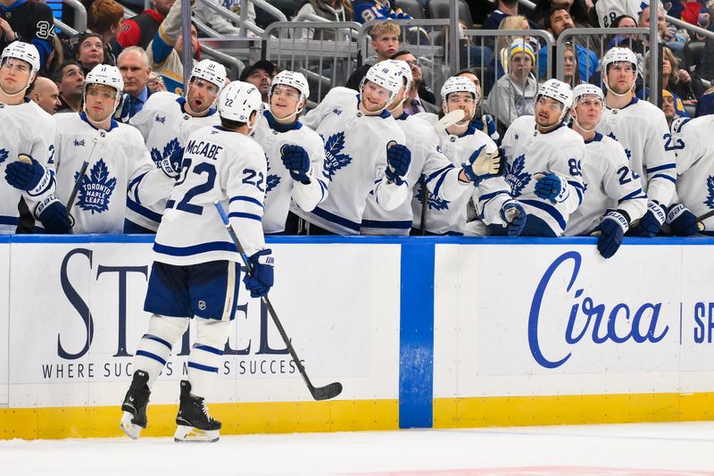 Mar 28, 2026; St. Louis, Missouri, USA; Toronto Maple Leafs defenseman Jake McCabe (22) is congratulated by teammates after scoring against the St. Louis Blues during the third period at Enterprise Center. Mandatory Credit: Jeff Curry-Imagn Images