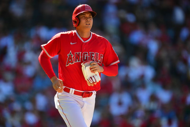 Jul 19, 2023; Anaheim, California, USA; Los Angeles Angels designated hitter Shohei Ohtani (17) reaches first on a walk against the New York Yankees during the first inning at Angel Stadium. Mandatory Credit: Gary A. Vasquez-USA TODAY Sports