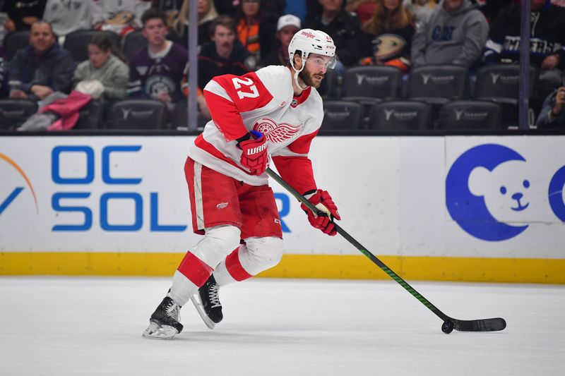 Nov 15, 2024; Anaheim, California, USA; Detroit Red Wings center Michael Rasmussen (27) controls the puck against the Anaheim Ducks during the first period at Honda Center. Mandatory Credit: Gary A. Vasquez-Imagn Images