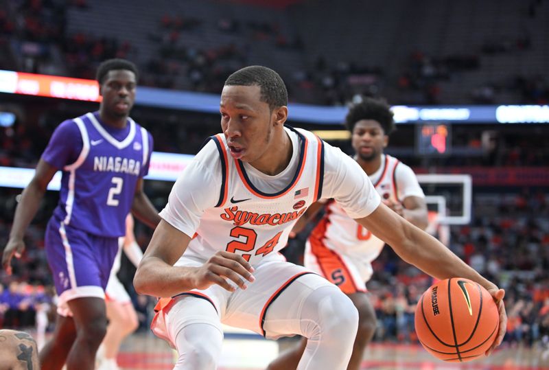 Dec 21, 2023; Syracuse, New York, USA; Syracuse Orange guard Quadir Copeland (24) handles the ball against the Niagara Purple Eagles in the second half at the JMA Wireless Dome. Mandatory Credit: Mark Konezny-USA TODAY Sports