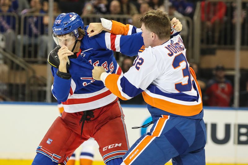 Sep 26, 2023; New York, New York, USA;  New York Rangers center Matt Rempe (73) fights New York Islanders left wing Ross Johnston (32) in the second period at Madison Square Garden. Mandatory Credit: Wendell Cruz-USA TODAY Sports