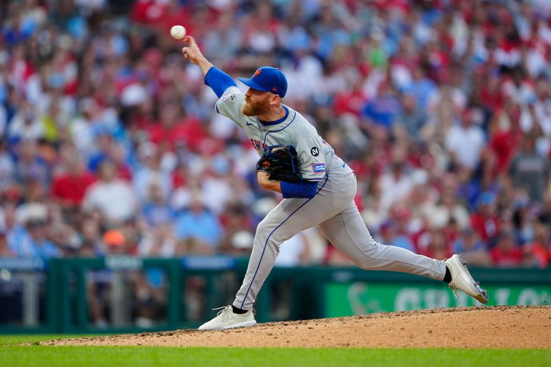 Sep 14, 2024; Philadelphia, Pennsylvania, USA; New York Mets pitcher Reed Garrett (75) delivers a pitch against the Philadelphia Phillies during the seventh inning at Citizens Bank Park. Mandatory Credit: Gregory Fisher-Imagn Images