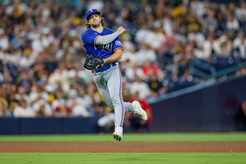 Jul 29, 2023; San Diego, California, USA;  Texas Rangers shortstop Josh Smith (47) throws the ball to first for the out during the eighth inning against the San Diego Padres at Petco Park. Mandatory Credit: David Frerker-USA TODAY Sports