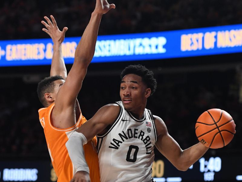 Feb 8, 2023; Nashville, Tennessee, USA; Vanderbilt Commodores guard Tyrin Lawrence (0) passes the ball around defense from Tennessee Volunteers guard Tyreke Key (4) during the first half at Memorial Gymnasium. Mandatory Credit: Christopher Hanewinckel-USA TODAY Sports