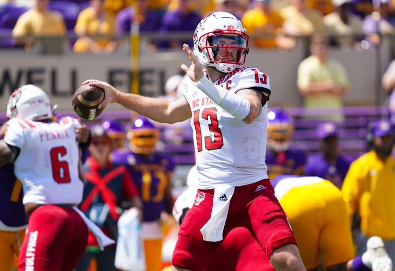 Sep 3, 2022; Greenville, North Carolina, USA;  North Carolina State Wolfpack quarterback Devin Leary (13) throws the ball against the East Carolina Pirates during the first half at Dowdy-Ficklen Stadium. Mandatory Credit: James Guillory-USA TODAY Sports