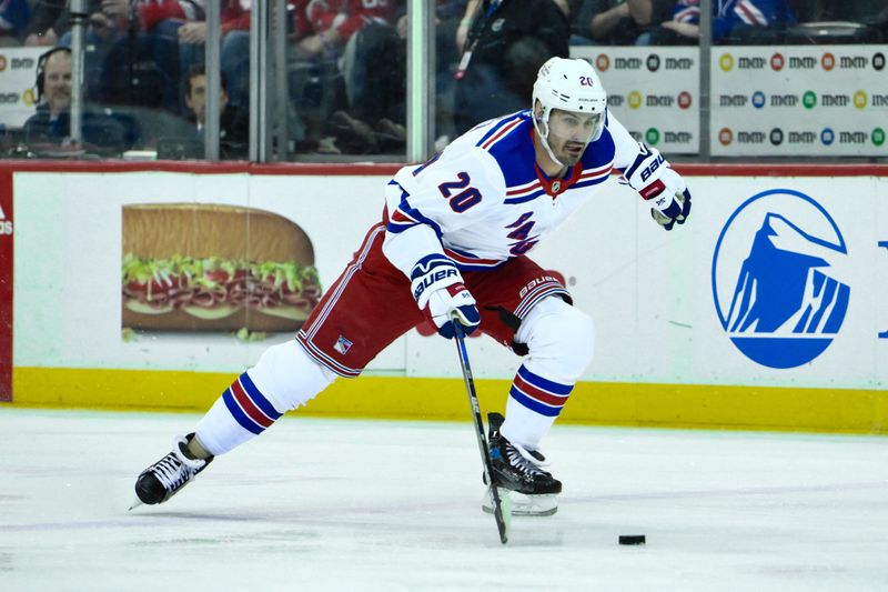 Feb 22, 2024; Newark, New Jersey, USA; New York Rangers left wing Chris Kreider (20) skates with the puck during the first period against the New Jersey Devils at Prudential Center. Mandatory Credit: John Jones-USA TODAY Sports