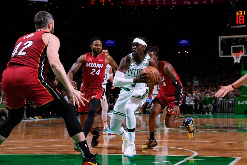 BOSTON, MA - APRIL 21: Jrue Holiday #4 of the Boston Celtics handles the ball during the game against the Miami Heat during Round 1 Game 1 of the 2024 NBA Playoffs on April 21, 2024 at the TD Garden in Boston, Massachusetts. NOTE TO USER: User expressly acknowledges and agrees that, by downloading and or using this photograph, User is consenting to the terms and conditions of the Getty Images License Agreement. Mandatory Copyright Notice: Copyright 2024 NBAE  (Photo by Brian Babineau/NBAE via Getty Images)