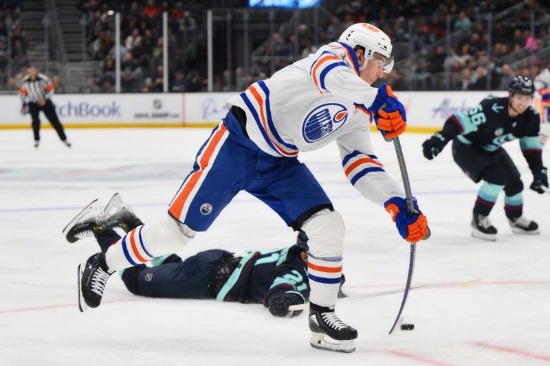 Mar 2, 2024; Seattle, Washington, USA; Edmonton Oilers center Ryan McLeod (71) shoots the puck against the Seattle Kraken during the first period at Climate Pledge Arena. Mandatory Credit: Steven Bisig-USA TODAY Sports