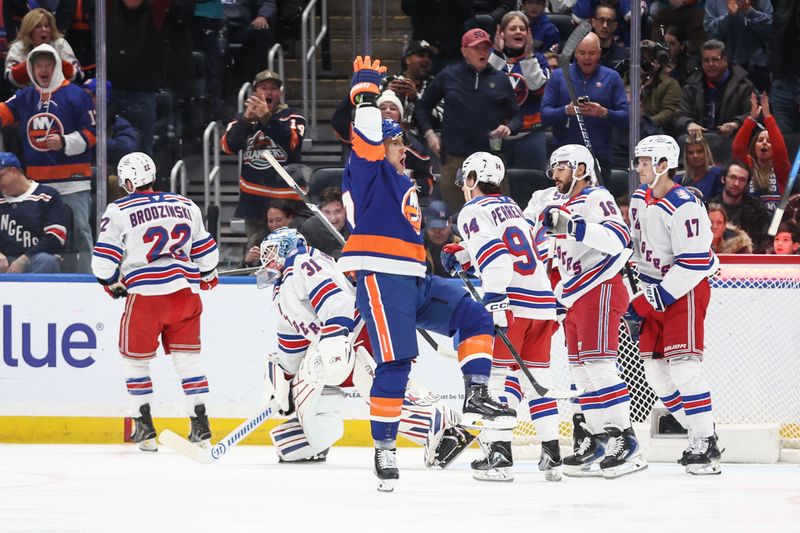 Dec 27, 2025; Elmont, New York, USA;  New York Islanders left wing Anders Lee (27) celebrates after scoring a goal in the first period against the New York Rangers at UBS Arena. Mandatory Credit: Wendell Cruz-Imagn Images