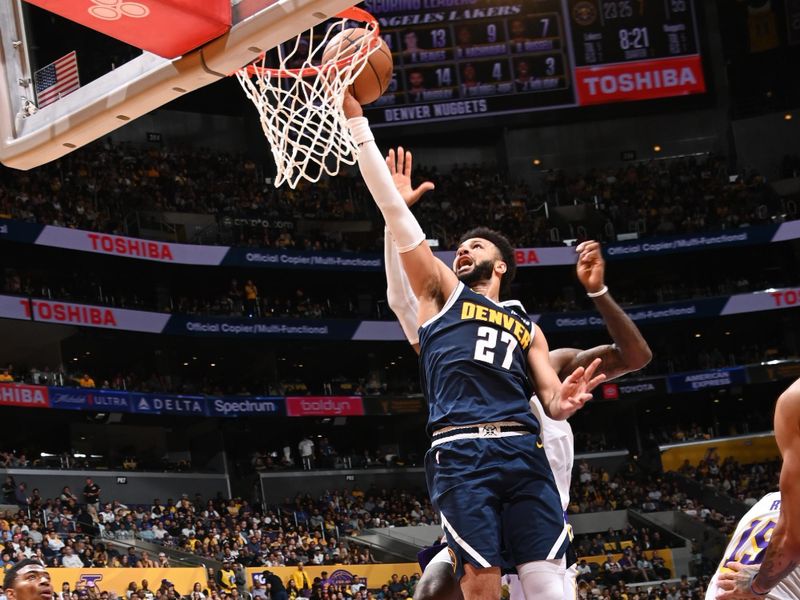 LOS ANGELES, CA - APRIL 27: Jamal Murray #27 of the Denver Nuggets drives to the basket during the game against the Los Angeles Lakers during Round 1 Game 4 of the 2024 NBA Playoffs on April 27, 2024 at Crypto.Com Arena in Los Angeles, California. NOTE TO USER: User expressly acknowledges and agrees that, by downloading and/or using this Photograph, user is consenting to the terms and conditions of the Getty Images License Agreement. Mandatory Copyright Notice: Copyright 2024 NBAE (Photo by Andrew D. Bernstein/NBAE via Getty Images)