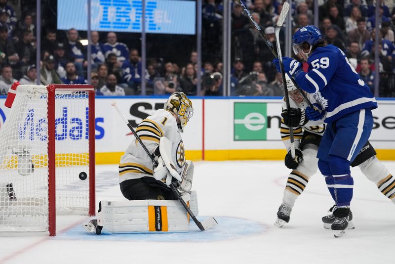 Apr 24, 2024; Toronto, Ontario, CAN; Toronto Maple Leafs forward Tyler Bertuzzi (59) scores against Boston Bruins goaltender Jeremy Swayman (1) during the third period of game three of the first round of the 2024 Stanley Cup Playoffs at Scotiabank Arena. Mandatory Credit: John E. Sokolowski-USA TODAY Sports