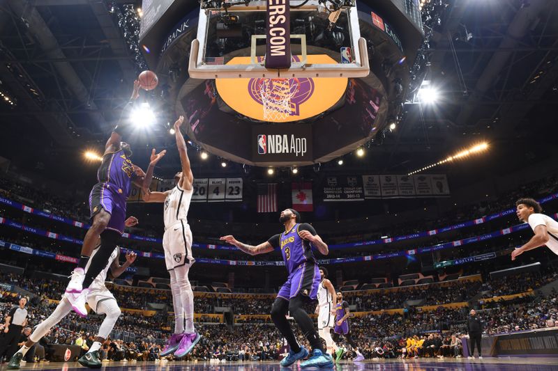 LOS ANGELES, CA - JANUARY 19:  LeBron James #23 of the Los Angeles Lakers goes to the basket during the game on January 19, 2024 at Crypto.Com Arena in Los Angeles, California. NOTE TO USER: User expressly acknowledges and agrees that, by downloading and/or using this Photograph, user is consenting to the terms and conditions of the Getty Images License Agreement. Mandatory Copyright Notice: Copyright 2024 NBAE (Photo by Adam Pantozzi/NBAE via Getty Images)