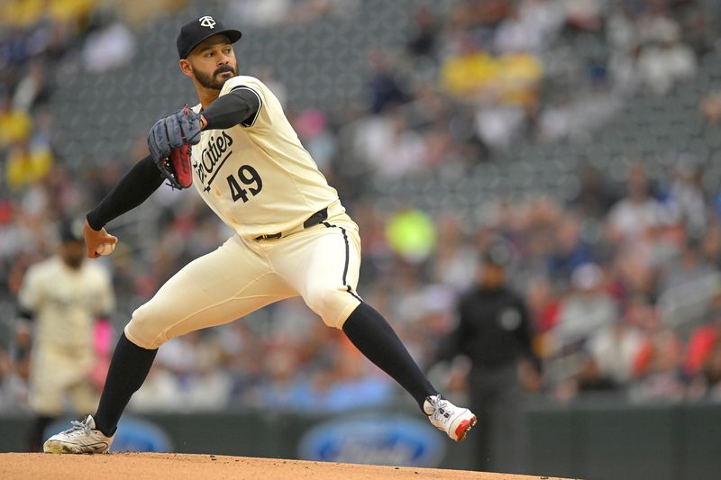 May 26, 2024; Minneapolis, Minnesota, USA;  Minnesota Twins pitcher Pablo Lopez (49) delivers a pitch against the Texas Rangers during the first inning at Target Field. Mandatory Credit: Nick Wosika-USA TODAY Sports