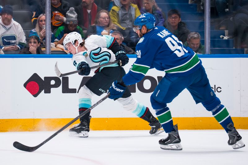Jan 2, 2026; Vancouver, British Columbia, CAN; Vancouver Canucks forward Evander Kane (91) watches as Seattle Kraken defenseman Cale Fleury (8) scores on this shot in the first period at Rogers Arena. Mandatory Credit: Bob Frid-Imagn Images