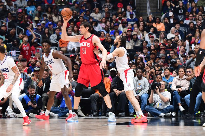 LOS ANGELES, CA - APIRL 14: Boban Marjanovic #51 of the Houston Rockets handles the ball during the game against the LA Clippers on April 14, 2024 at Crypto.Com Arena in Los Angeles, California. NOTE TO USER: User expressly acknowledges and agrees that, by downloading and/or using this Photograph, user is consenting to the terms and conditions of the Getty Images License Agreement. Mandatory Copyright Notice: Copyright 2024 NBAE (Photo by Adam Pantozzi/NBAE via Getty Images)